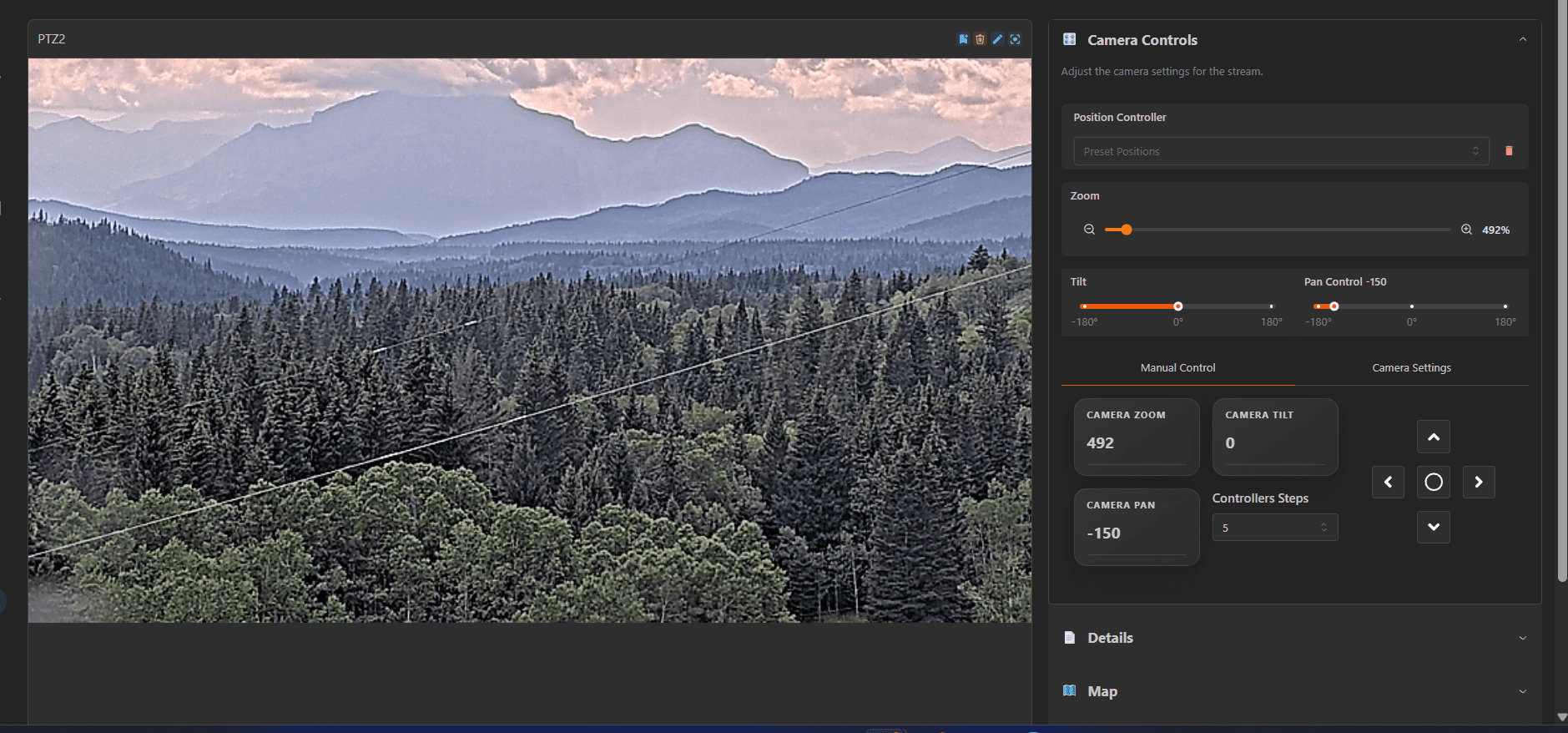 Live camera feed interface showing a forested mountain landscape with multiple tree-covered ridges fading into the distance under a cloudy sky. Overlaid utility lines cross the foreground. On the right, camera control settings are visible, including zoom at 492%, tilt at 0°, pan at -150°, and manual control buttons for zoom, tilt, and pan adjustments.